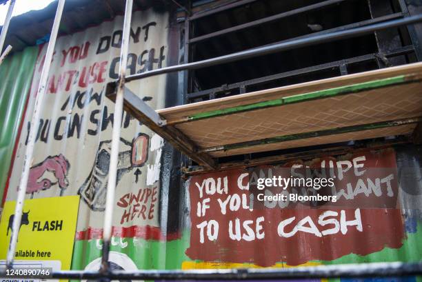 Sign advertising contactless payment outside a convenience store in the Soweto district of Johannesburg, South Africa, on Wednesday, March 4, 2020....