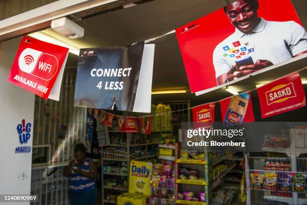 Banners for the A2 payment service at the entrance to a convenience store in the Soweto district of Johannesburg, South Africa, on Wednesday, March...