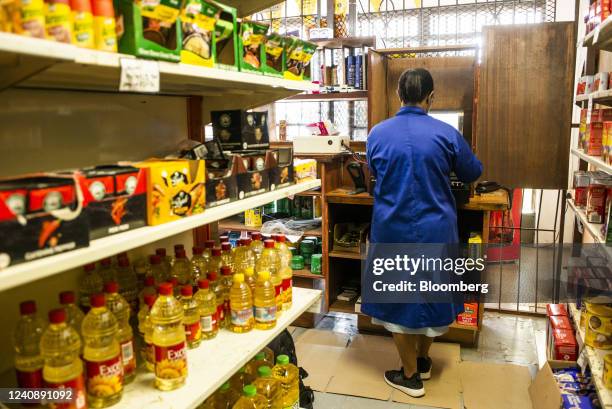 Shopkeeper waits for customers inside a convenience store in the Soweto district of Johannesburg, South Africa, on Wednesday, March 4, 2020. South...
