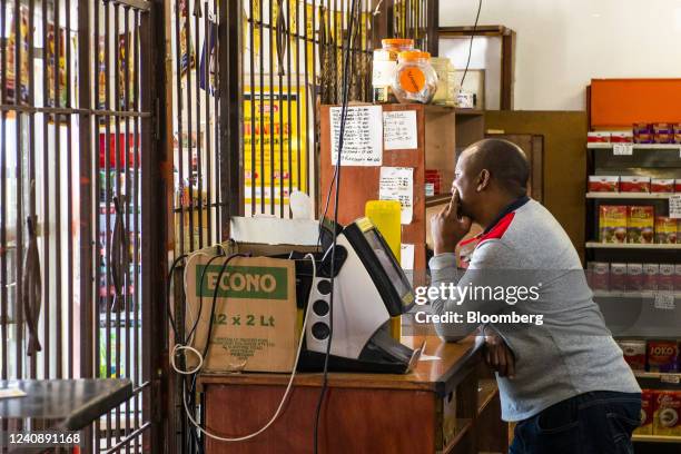 Shopkeeper waits for customers inside a convenience store in the Soweto district of Johannesburg, South Africa, on Wednesday, March 4, 2020. South...