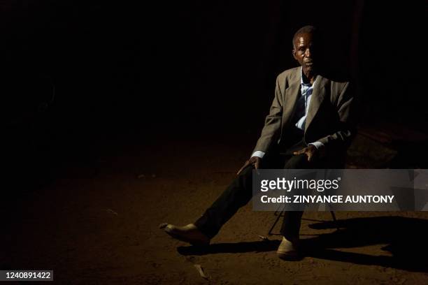 Hanganani Gideon Dube a local farmer poses for a portrait at his homestead in Mabale Village, Hwange, Zimbabwe, on May 24, 2022. - Over a year ago,...