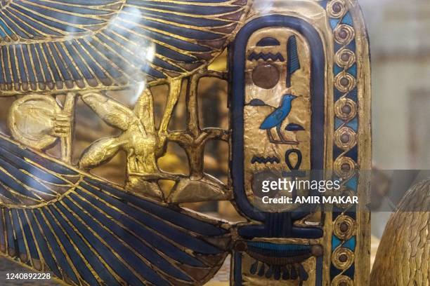 This picture taken on May 3, 2022 shows a view of the gilded throne of the ancient Egyptian New Kingdom Pharaoh Tutankhamun , found in 1922 at his...