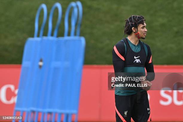 Liverpool's English defender Trent Alexander-Arnold wears analytical data headgear during a training session at their training ground in Liverpool,...