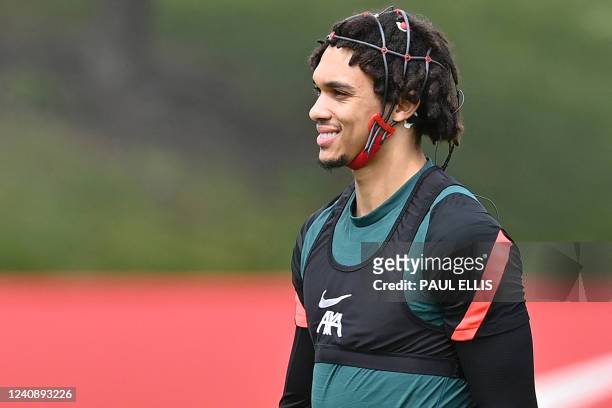 Liverpool's English defender Trent Alexander-Arnold wears analytical data headgear during a training session at their training ground in Liverpool,...