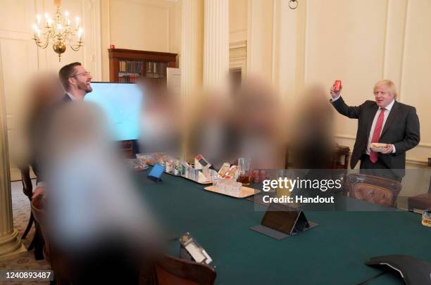 In this handout photo taken on 19 June 2020; UK Prime Minister Boris Johnson at a gathering in the Cabinet Room in 10 Downing Street on the Prime...