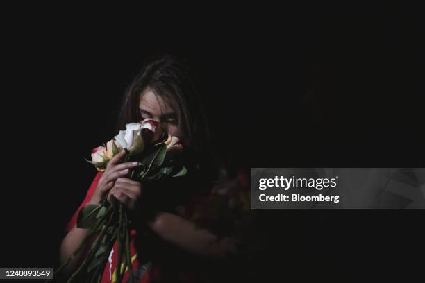 Child holds roses outside the Willie de Leon Civic Center in Uvalde, Texas, US, on Tuesday, May 24, 2022. President Joe Biden mourned the killing of...