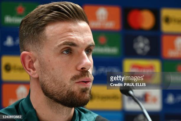 Liverpool's English midfielder Jordan Henderson speaks during a press conference at their training ground in Liverpool, northwest England, on May 25...