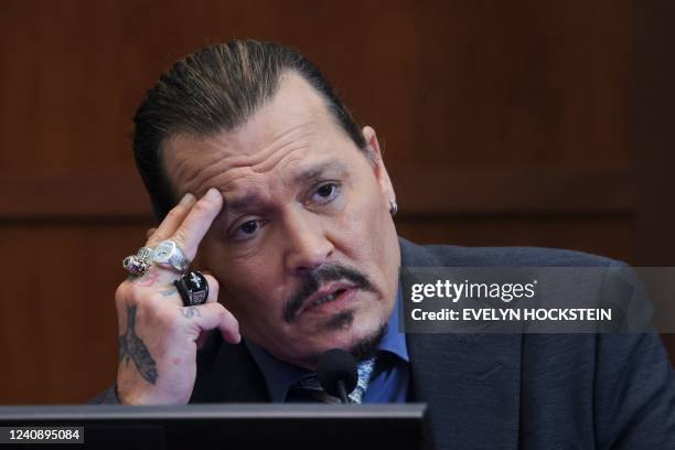 Actor Johnny Depp testifies at the Fairfax County Circuit Courthouse in Fairfax, Virginia, on May 25, 2022. - Actor Johnny Depp is suing ex-wife...