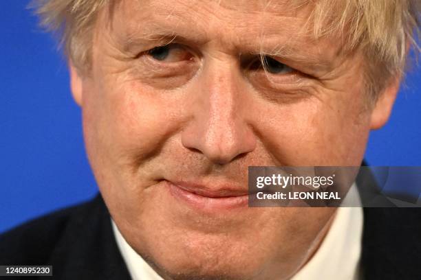 Britain's Prime Minister Boris Johnson attends a press conference in the Downing Street Briefing Room in central London on May 25 following the...