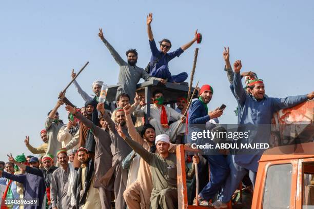 Supporters of Pakistan's former prime minister Imran Khan, take part in a protest rally in Swabi on May 25, 2022. - Khan on May 25 led a convoy of...