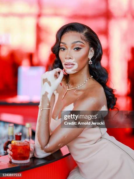 Winnie Harlow enjoys a Campari cocktail in the Campari Lounge, inside the Palais des Festival after walking the red carpet before the World Premiere...