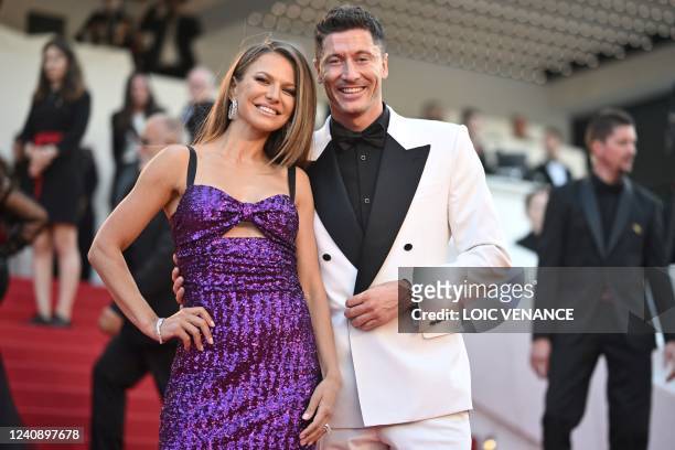 Polish striker Robert Lewandowski and his wife Anna Lewandowska arrive for the screening of the film "Elvis" during the 75th edition of the Cannes...
