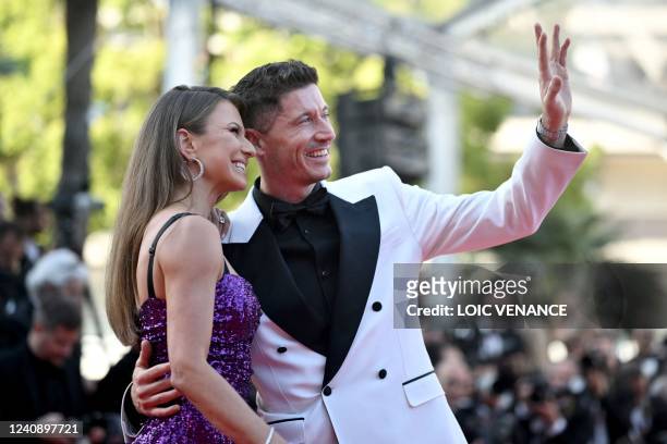 Polish striker Robert Lewandowski and his wife Anna Lewandowska arrive for the screening of the film "Elvis" during the 75th edition of the Cannes...