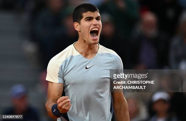Spain's Carlos Alcaraz reacts as he plays against Spain's Albert Ramos-Vinolas during their men's singles match on day four of the Roland-Garros Open...