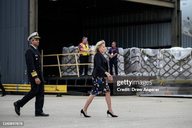 Surgeon General Vivek Murthy and First Lady Jill Biden arrive to speak as a FedEx cargo plane delivers baby formula at Dulles International Airport...