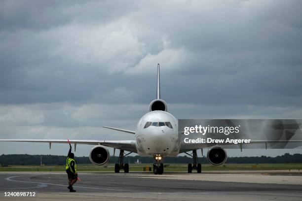 FedEx cargo plane carrying pallets of baby formula arrives at Dulles International Airport on May 25, 2022 in Dulles, Virginia. More than 100 pallets...