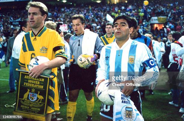 October 1993 Sydney, FIFA World Cup play-off match - Australia v Argentina - Diego Maradona leads out the visiting team as Australian captain Paul...