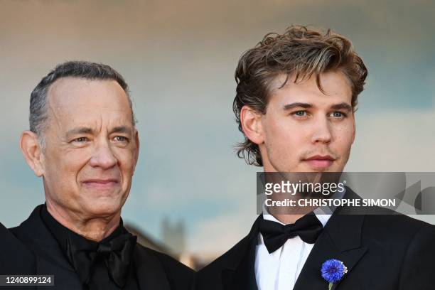 Actor Tom Hanks and US actor Austin Butler arrive for the screening of the film "Elvis" during the 75th edition of the Cannes Film Festival in...