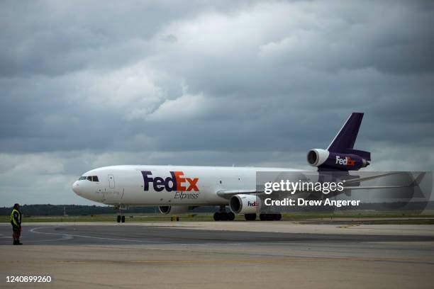 FedEx cargo plane carrying pallets of baby formula arrives at Dulles International Airport on May 25, 2022 in Dulles, Virginia. More than 100 pallets...