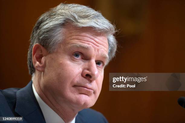 Director Christopher Wray looks on during a Senate Appropriations Subcommittee hearing on the fiscal year 2023 budget for the FBI at the U.S. Capitol...