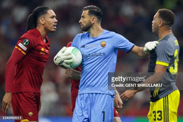 Roma's British defender Chris Smalling confronts Feyenoord's Nigerian forward Cyriel Dessers during the UEFA Europa Conference League final football...