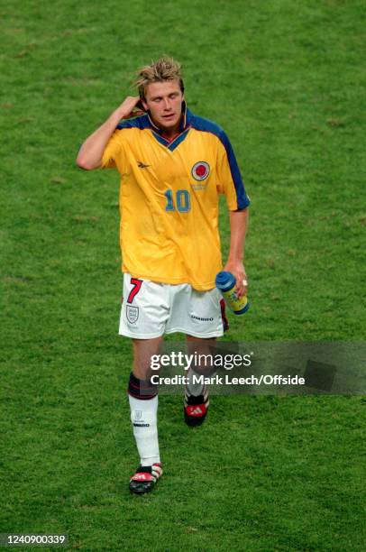 June 1998, Lens - FIFA World Cup - Colombia v England - David Beckham of England departs wearing the exchanged shirt of Carlos Valderrama.