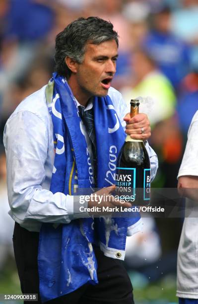 April 2006, London, Premiership Football, Chelsea v Manchester United - Chelsea manager Jose Mourinho celebrates winning the title with champagne.