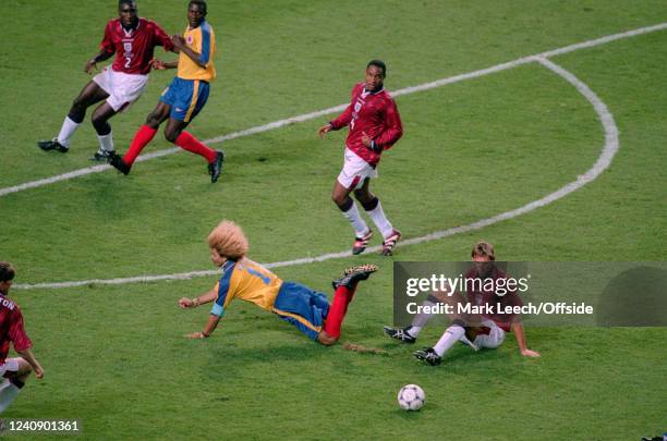 June 1998, Lens - FIFA World Cup - Colombia v England - Carlos Valderrama of Colombia is stopped by Tony Adams as Paul Ince watches.