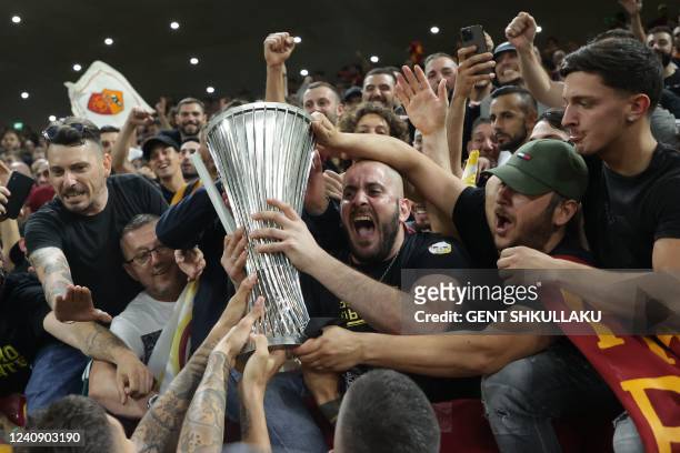 Roma's players present the trophy to the fans after the UEFA Europa Conference League final football match between AS Roma and Feyenoord at the Air...