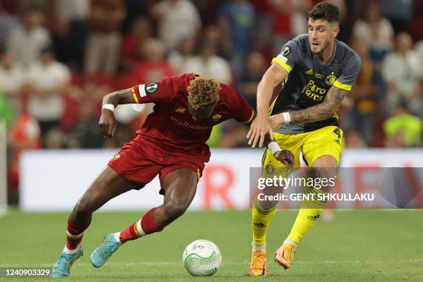 Feyenoord's Argentinian defender Marcos Senesi fouls Roma's British forward Tammy Abraham during the UEFA Europa Conference League final football...