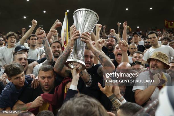 Roma's players present the trophy to their fans after the UEFA Europa Conference League final football match between AS Roma and Feyenoord at the Air...