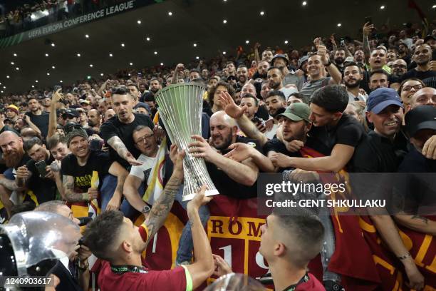 Roma's players present the trophy to their fans after the UEFA Europa Conference League final football match between AS Roma and Feyenoord at the Air...