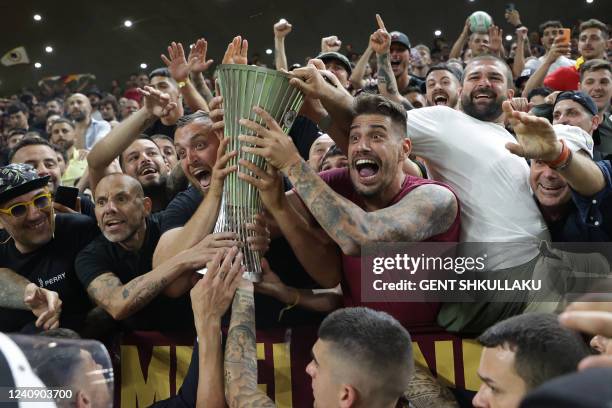 Roma's players present the trophy to their fans after the UEFA Europa Conference League final football match between AS Roma and Feyenoord at the Air...