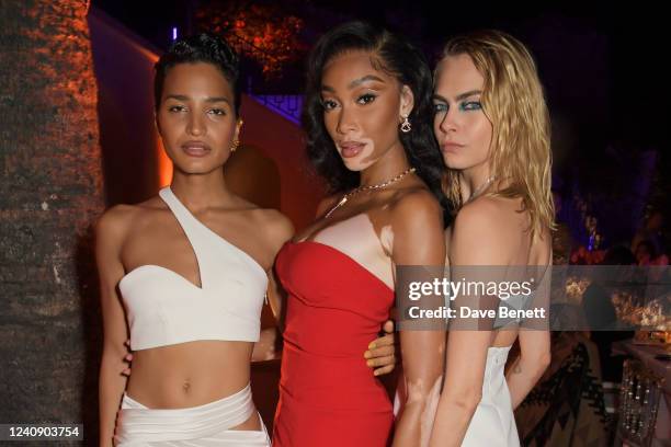 Indya Moore, Winnie Harlow and Cara Delevingne attend an intimate dinner hosted by Monot during the 75th Cannes Film Festival at Villa Bagatelle on...