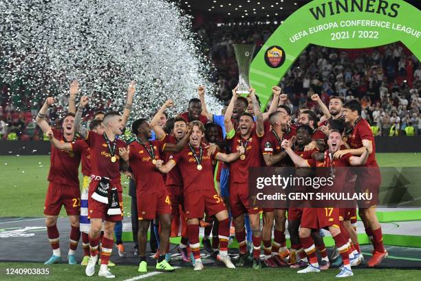 Roma's players celebrate with the trophy after winning the UEFA Europa Conference League final football match between AS Roma and Feyenoord at the...