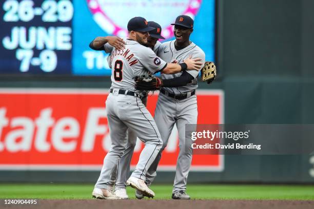 Robbie Grossman, Derek Hill, and Daz Cameron of the Detroit Tigers celebrate a 4-2 victory against the Minnesota Twins at Target Field on May 25,...