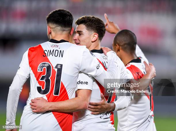 Julian Alvarez of River Plate celebrates with teammates Santiago Simon and Nicolás De La Cruz after scoring the sixth goal of his team during the...