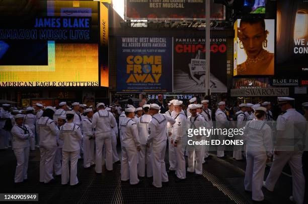 Servicemembers gather for a group photo in Times Square, as part of 'Fleet Week' celebrations in New York on May 25, 2022. - Fleet Week is a...