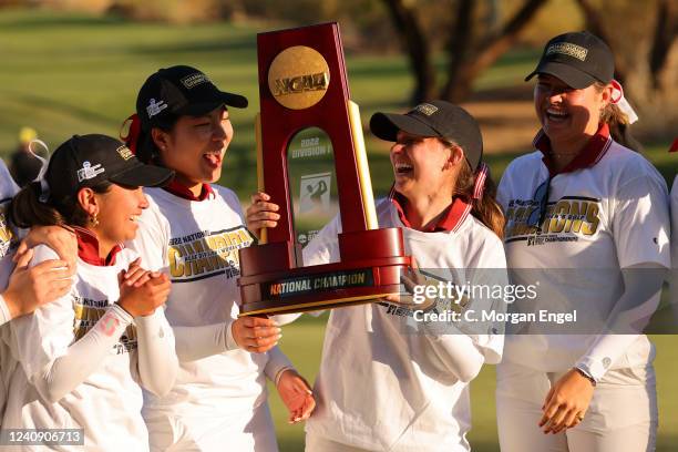 Brooke Seay of the Stanford Cardinal celebrates with teammates and the national championship trophy after defeating the Oregon Ducks during the...