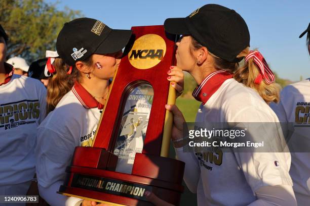 Caroline Sturdza of the Stanford Cardinal kisses the national champion trophy alongside Rachel Heck of the Stanford Cardinal during the Division I...