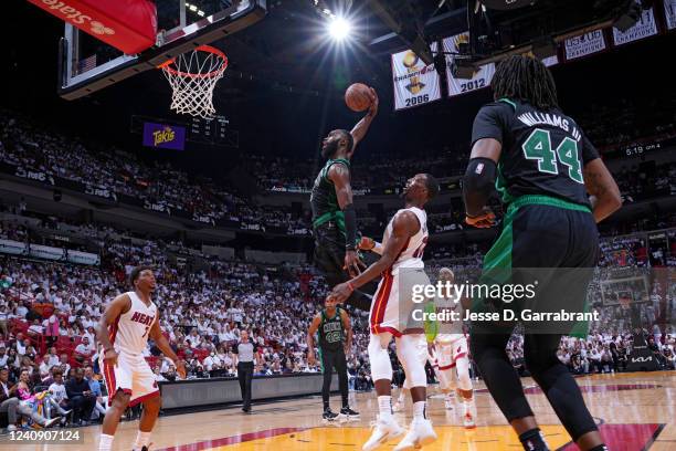 Jaylen Brown of the Boston Celtics dunks the ball against Bam Adebayo of the Miami Heat during Game 5 of the 2022 NBA Playoffs Eastern Conference...