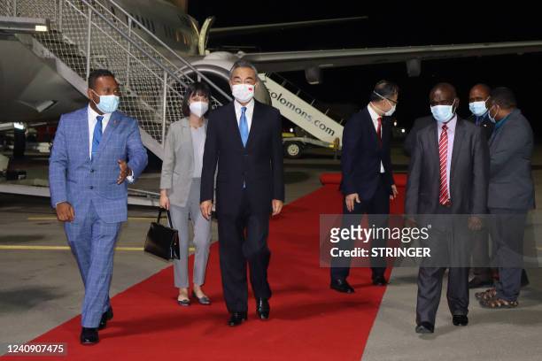 This picture taken on May 25 shows Solomon Island's Foreign Minister Jeremiah Manele escorting Chinese Foreign Minister Wang Yi upon his arrival at...