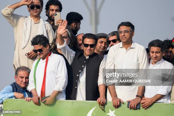 Ousted Pakistan's prime minister Imran Khan waves at his party supporters during a rally in Islamabad on May 26, 2022. - Pakistan called in the army...