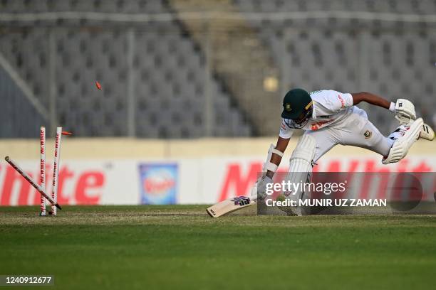 Bangladesh's Najmul Hossain Shanto gets run out by Sri Lanka's Praveen Jayawickrama during the fourth day of the second Test cricket match between...