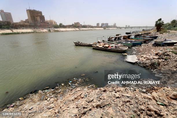Wooden ferry boats are moored along the right bank of the Tigris river in the centre of Iraq's capital Baghdad on May 26 as the river's water levels...