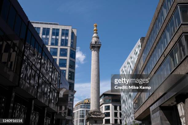 Monument, Sir Christopher Wren's flame-topped gold monument to the Great Fire of 1666 on 17th May 2022 in London, United Kingdom.