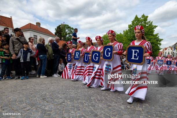 Illustration picture shows participants holding the letters B R U G G E during the Holy Blood Procession event, on Thursday 26 May 2022 in Brugge....