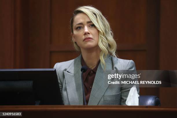 Actor Amber Heard testifies during the 50 million US dollar Depp vs Heard defamation trial at the Fairfax County Circuit Court in Fairfax, Virginia,...