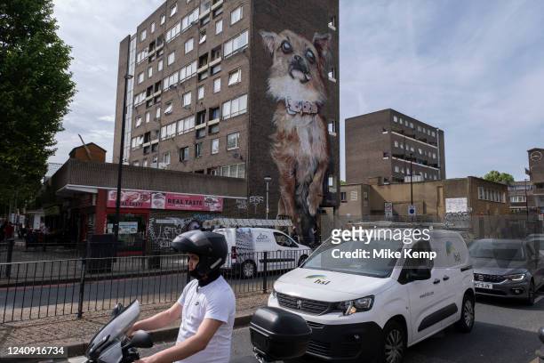 Giant Chihuahua by street Artists Boe & Irony on Chrisp Street in Poplar on 18th May 2022 in East London, United Kingdom. Street art is an ever...