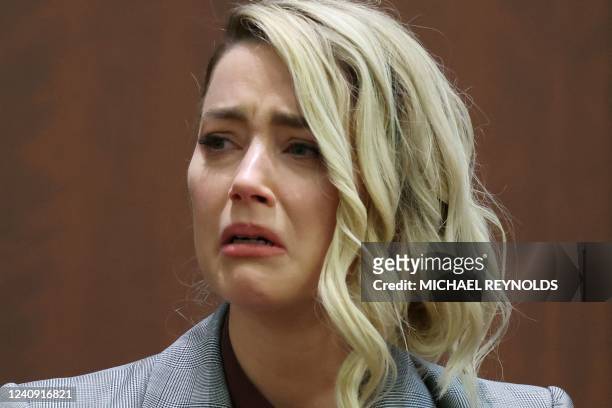 Actor Amber Heard testifies during the 50 million US dollar Depp vs Heard defamation trial at the Fairfax County Circuit Court in Fairfax, Virginia,...